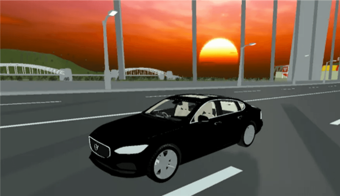 DriVR car model driving over a bridge with the sun setting in the background.